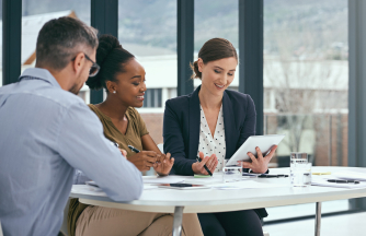 Solicitors discussing their financial records with an expert accountant.